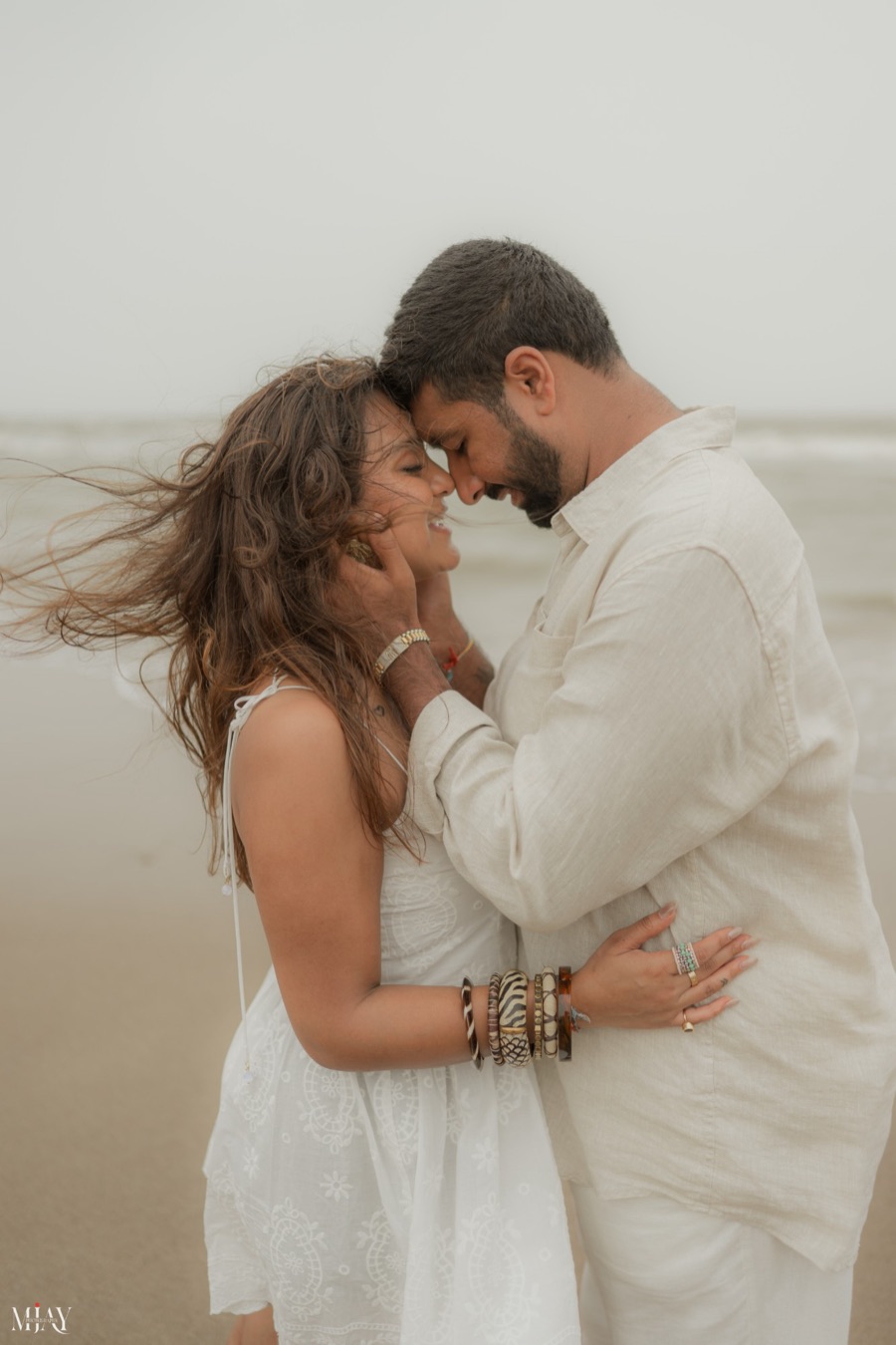 Viren and Pooja forehead to forehead by the sea